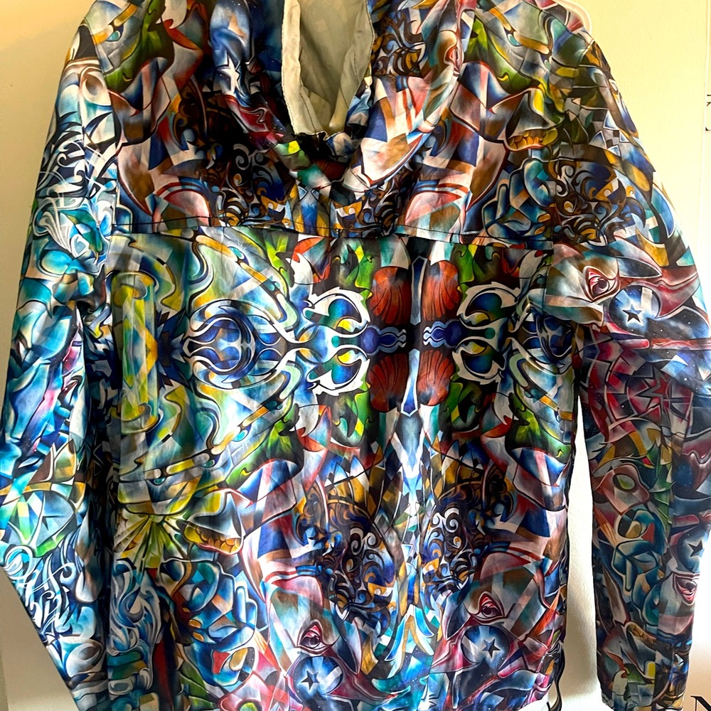 Multicolor Kway X Lar Dux Courvoisier windbreaker jacket with hood.